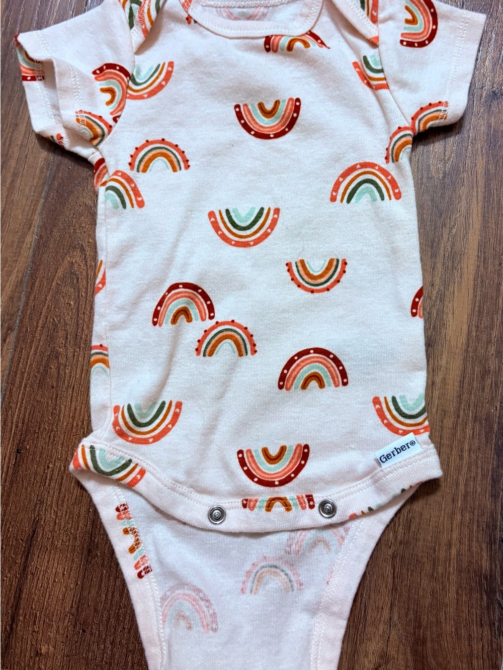 Gerber Cream Onesie with Orange, Green & Rust Rainbows